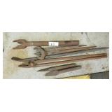 Lot of  various spud wrenches and pair of pliers