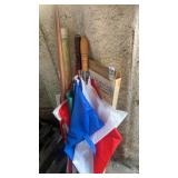 Corner lot of assorted umbrellas , flag pole ,