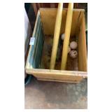 Wooden crate with wiffle ball items