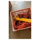 Crate of extension cords and level