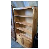 Knotty pine bookcase w/ storage