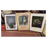 Two photos and a poster in frames