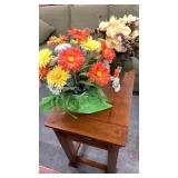 Pair of artificial flowers in vases