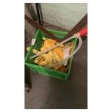 Milk crate full with ice scrapers , ruler