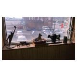 Cast bell, goods on windowsill cigars dog