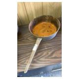 Cast iron footed camp skillet - long handle