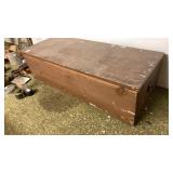Large wooden chest of antique clothing lined with
