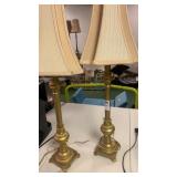 2 gold lamps with shades
