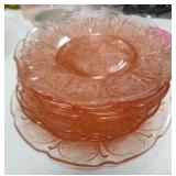 Stack of pink Depression plates