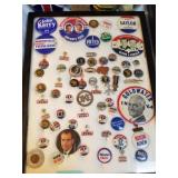 Vintage political buttons in display case