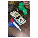 Toy tractor, car and space shuttle