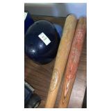 2 wooden baseball bats and plastic batting helmet