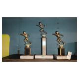Three small football trophies