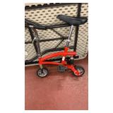 Small red scooter bike