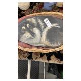 Painted dog stone in basket