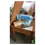 White sewing machine in cabinet