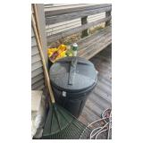 Garbage can a rakes and outdoor hose