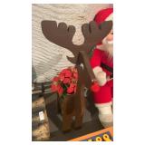 Wooden Rudolph plant holder with pointsetta