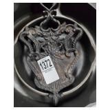 2 cast iron skillets and 2 cast iron trivet