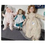 Three porcelain dolls