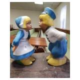 Pair of  cement kissing Dutch girl and boy