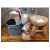 Little tin watering can and wooden stool