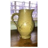 Signed pottery pitcher 8-1/2" tall