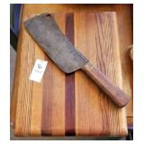Wooden cutting board with cleaver