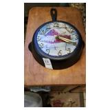 Cast iron wall clock and wooden cutting board