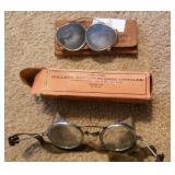 Pair of old clip on sunglasses and old Wilson
