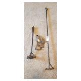 2 old branding irons and corn sheller