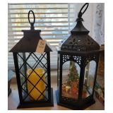 Two battery powered lanterns one Christmas themed