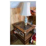 Glass top end table w/ floral lamp, magazines