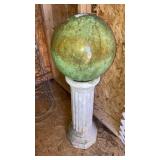 Gazing ball on concrete stand