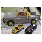 2 toy cars and truck