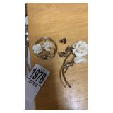 2 broach pins and lions pin