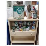 All oil cans and shelving unit