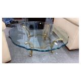 Beveled glass coffee table on brass base 41" diam