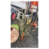 Green metal plant stand and shepherds hook