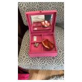 Pink jewelry box with contents