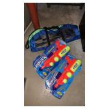 2 squirt guns and badminton set