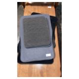 Stack of miscellaneous car floor mats