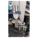 Wooden patriotic welcome sign and lighted