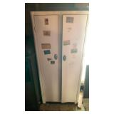 Metal cabinet with contents 63 inches tall
