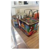 3 cookies and chocolate tins