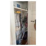 Closet contents including Hoover vac