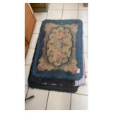 Stack of rubber back rugs