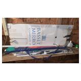 Shelf lot of umbrellas and other