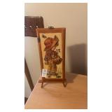 pair of wall hangings on easels