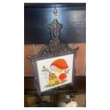 Pair of cast trivets and wooden trivet